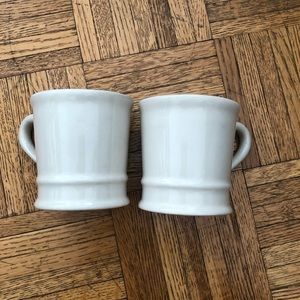 2 cream USA pottery mugs